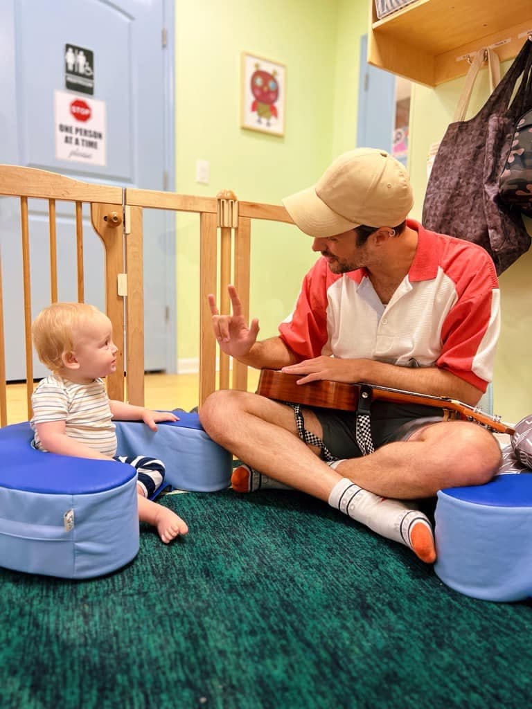Child engaged in Music & Sign Language activity
